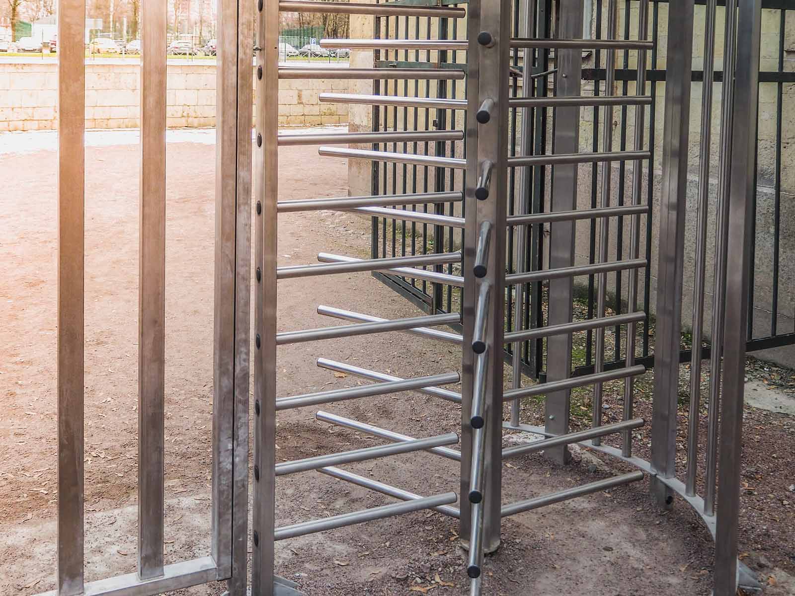 rotating access gates installed at a construction site to provide secure access for personnel. 