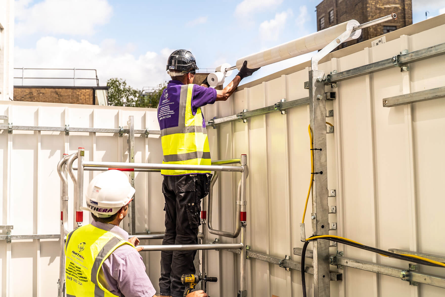 panthera employee installing temporary site fencing