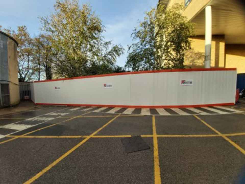 Panthera Group's EnviroHoard™ at a construction site entrance, showcasing sustainable, reusable hoarding for reduced carbon emissions and improved BREEAM scores.